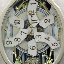 Load image into Gallery viewer, Moving Face Pendulum Wall Clock - Plays Melodies Every Hour